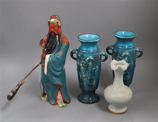 A Chinese celadon vase, a Chinese figure and two turquoise dragon vases